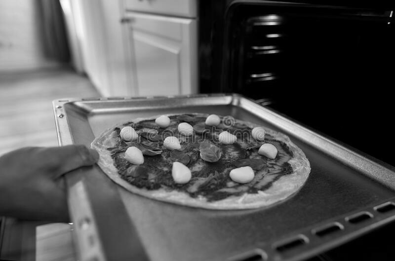 How to Transfer an Uncooked Pizza to a Pizza Stone photo 7